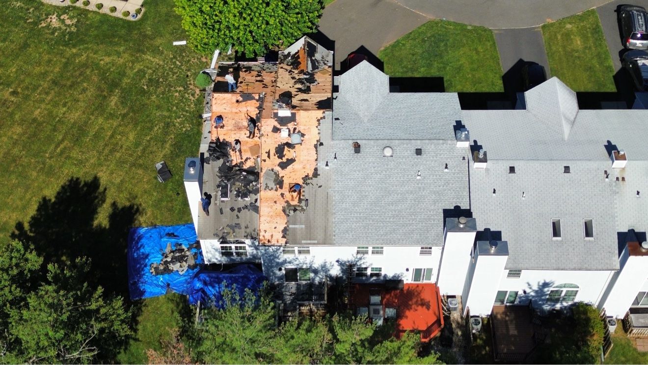 Roof replacement in progress seen from a drone